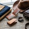 Western leather hat, Markore Hunza Fold and Markore Ravi Slip and Markore Hour Line Universal watch strap sitting on a wooden table
