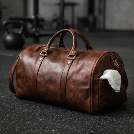 lifestyle image of a markore leather duffle bag sitting on the gym floor