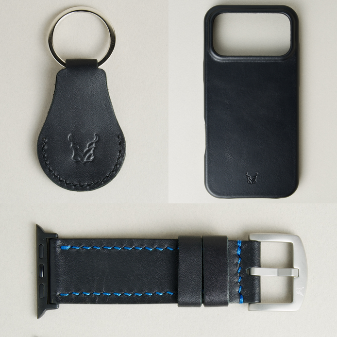 Three premium leather items for apple products in midnight black: airtag keychain with metal key ring and embossed Markore logo, iphone 17 case with embossed Markore logo and watch strap handstitched in blue with silver metal buckle and black adapter.