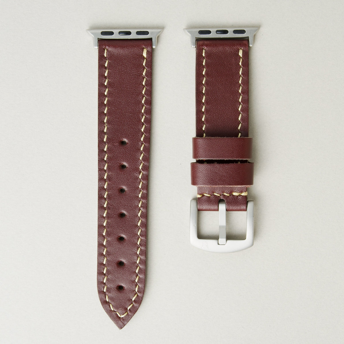 Espresso brown full-grain leather watch strap with silver stainless steel adapters and buckle, featuring ivory stitching and matching loops. Markore Hour Line.