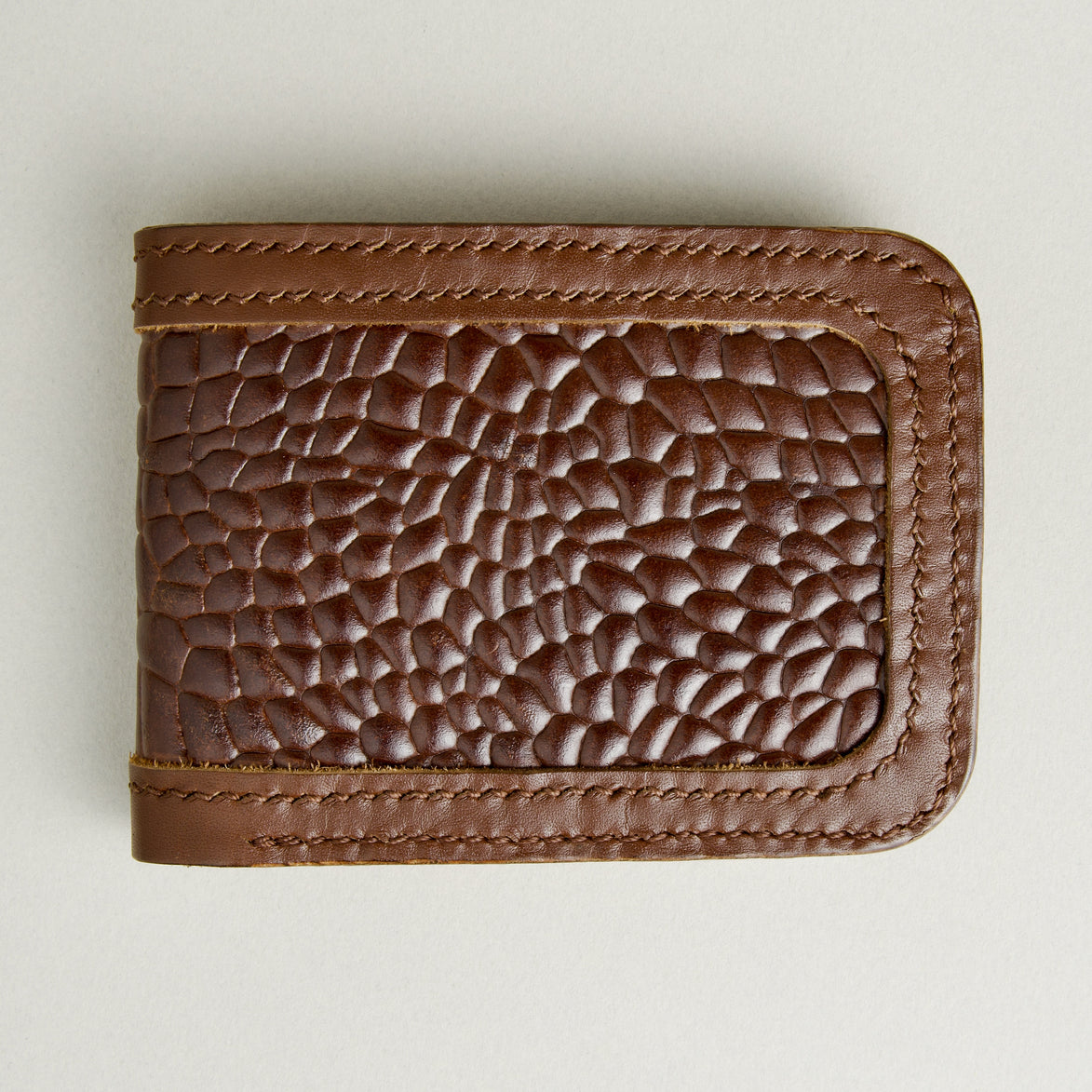 Front view of espresso brown croc-embossed full-grain leather bifold wallet featuring handmade stitching. Markore Indus Sultan