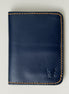 Front view of dark blue full-grain leather wallet featuring amber handmade stitching and embossed logo. Markore Ravi Edge.