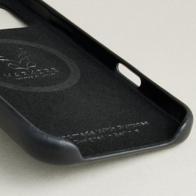 Detail of inside of midnight black leather iphone 17 pro case showing velvet lining and branding. Markore Shell Frame.