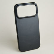 Outside side view of midnight black leather iPhone 17 pro cover with full cutout featuring embossed brand logo. Markore Shell Frame.