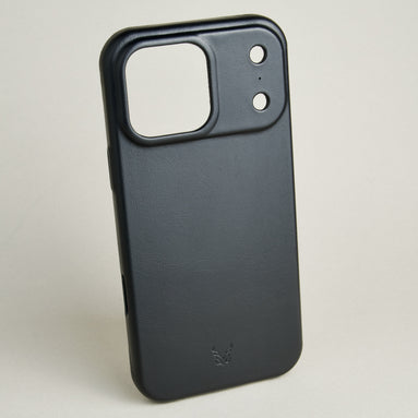 Outside side view of midnight black leather iPhone 17 pro cover wiht camera cutout featuring embossed brand logo. Markore Shell Guard.