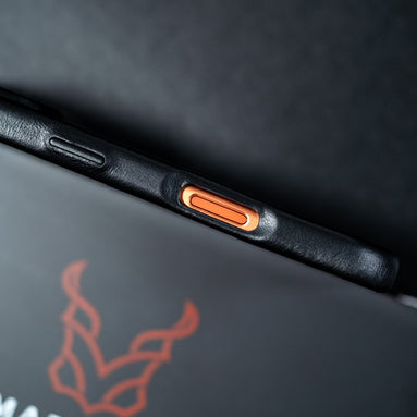 Close-up of Markore Shell Guard iPhone 7 phone case with a brand logo on a dark background
